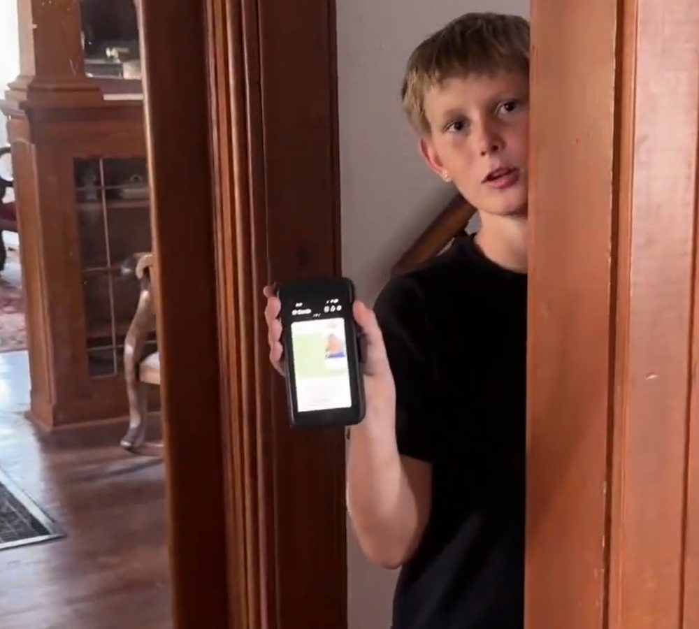 The same Homeschool Pro student showing his digital student ID on his phone